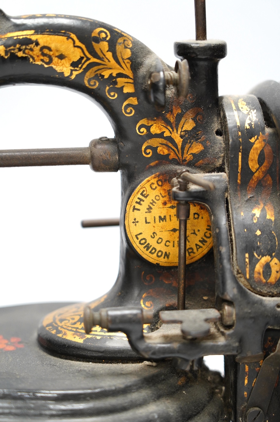 A late 19th century Bradbury & Co Wellington sewing machine on a cast iron base with gilt and floral decoration. Condition - fair